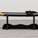 Katana sword on the wooden floor background front view.