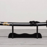 Katana sword on the wooden floor background front view.